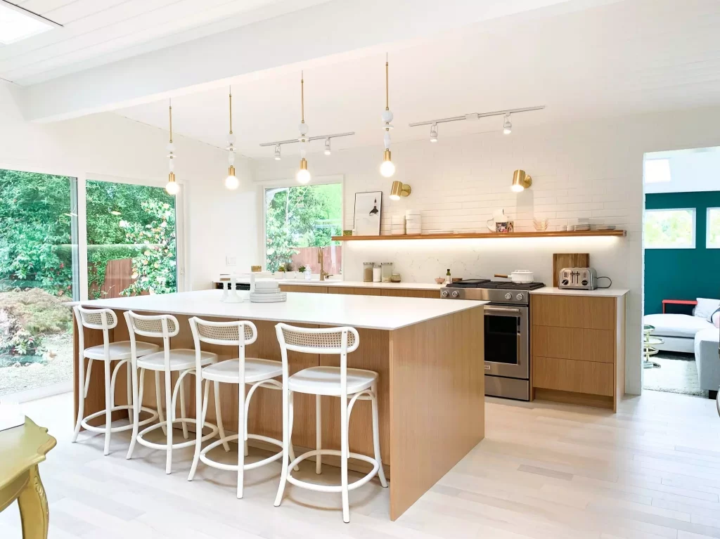 modern boho kitchen with vg doug fir cabinet fronts and white chairs on island